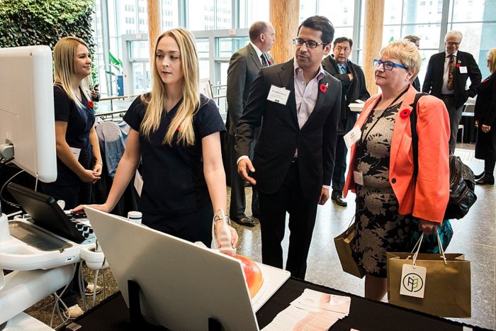 Health professional showing a woman how a product works