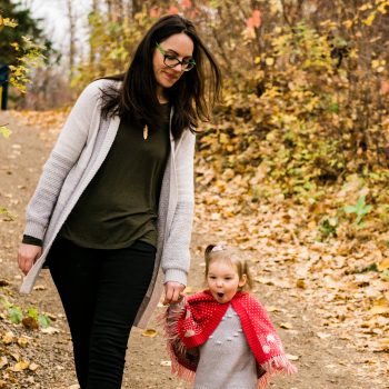 Baby looks surprised walking with Mom in Gold Bar Park