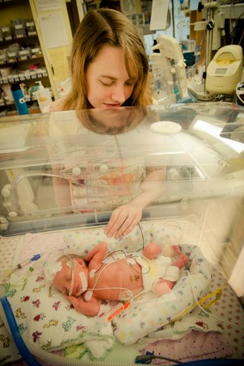 Mother visits her baby girl in the NICU